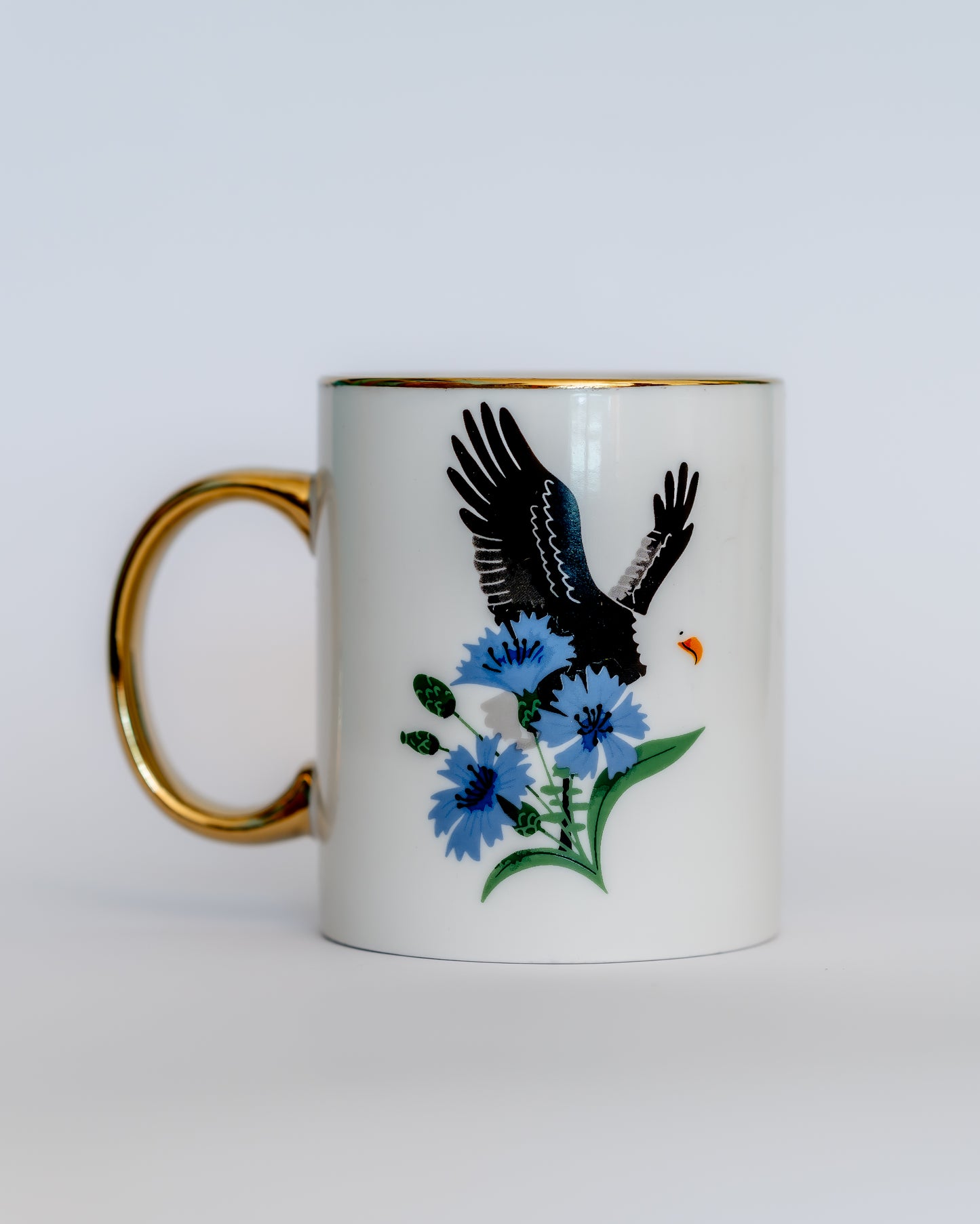 Keramiktasse mit Adler und Schriftzug